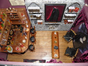  The "coffin" table was an idea from one of Sherrilyn Kenyon's novels, and the name comes from the George Clooney movie.